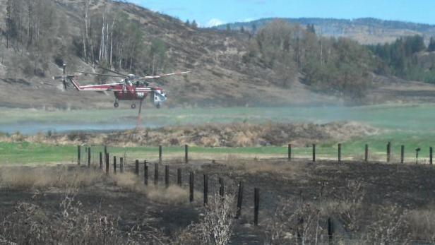 Drawing water f rom a nearby water source [Photo credit: inciweb]