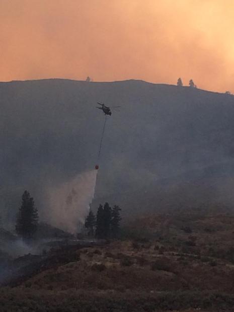 Dropping water on the fire [Photo Credit: inciweb]